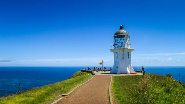 Cape Reinga Lighthouse and world sign post, Northland, New Zealand.