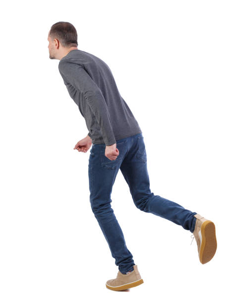 istock back view of running  man. 1130784157