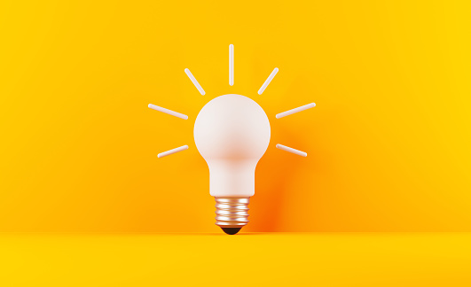 Light bulb on yellow background. Horizontal composition with copy space. Creativity and innovation concept.