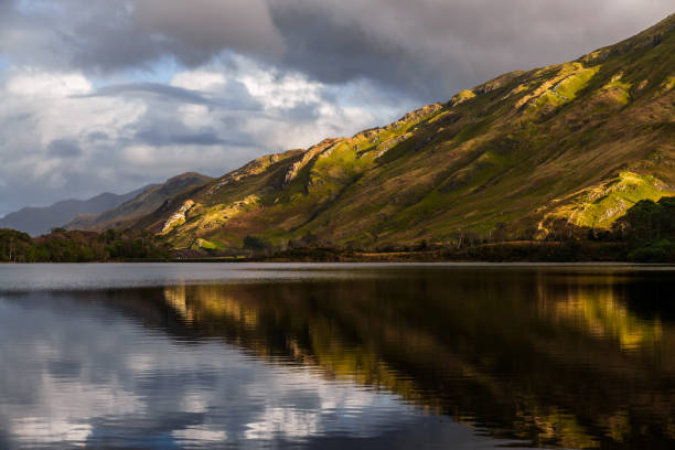 istock Stormy sky, mountains and lake in Connemara 1130790091