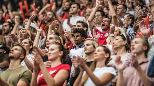 istock People cheering and clapping at a football match 1130790221