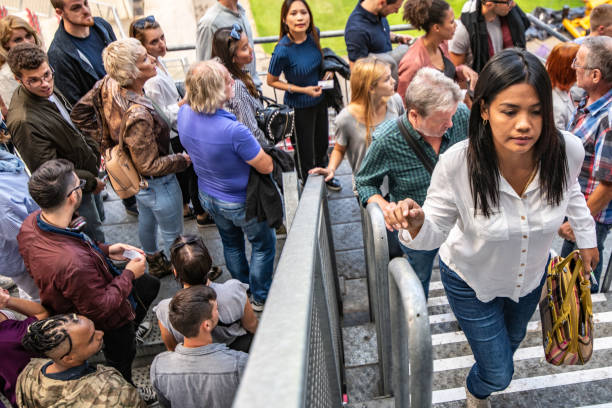 istock People walking up the stairs on a stadium 1130790240