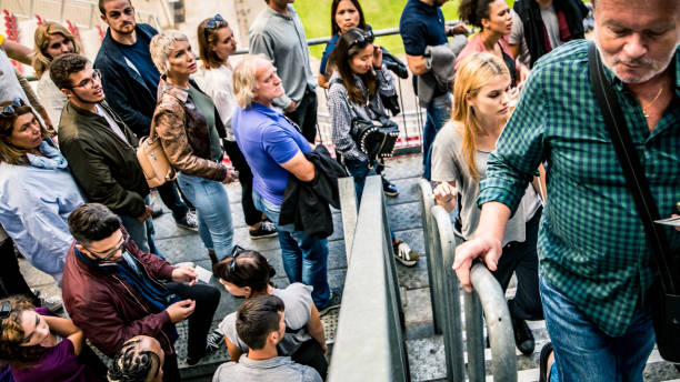 istock People walking up the steps of a stadium 1130790245