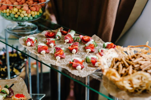 istock Light snacks in a plate on a buffet table. Assorted mini canapes, delicacies and snacks, restaurant food at event. Seafood. A gala reception. Decorated delicious table for a party goodies. 1130791249