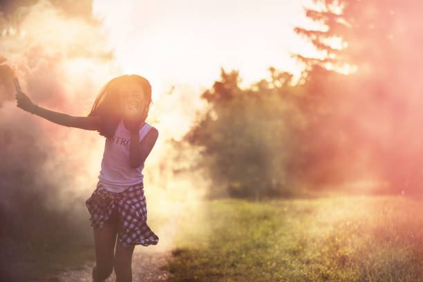 Angry girl in pink smoke.