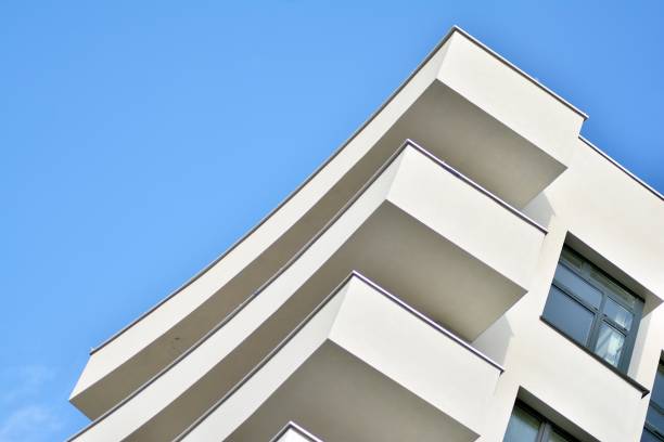 istock Modern white building with balcony on a blue sky 1130795559