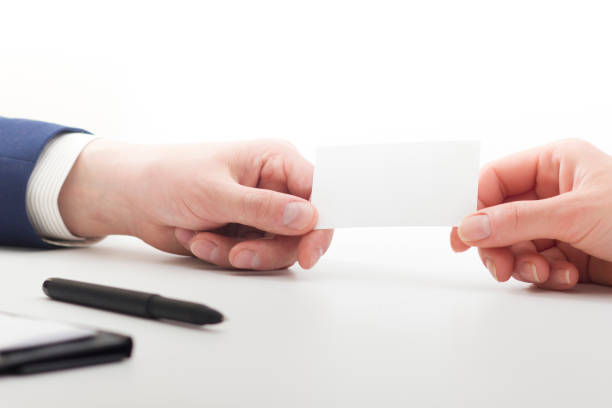 istock business executive exchanging business card blank 1130796428