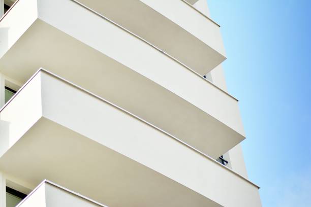 istock Modern white building with balcony on a blue sky 1130796511