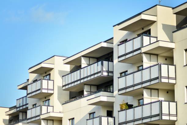 istock Modern white building with balcony on a blue sky 1130798243