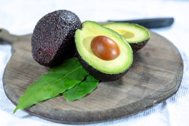 istock Two ripe raw hass avocados close up 1130798266