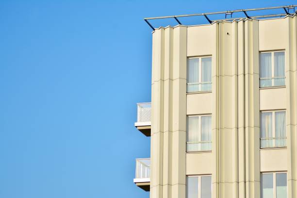 istock Modern white building with balcony on a blue sky 1130798499