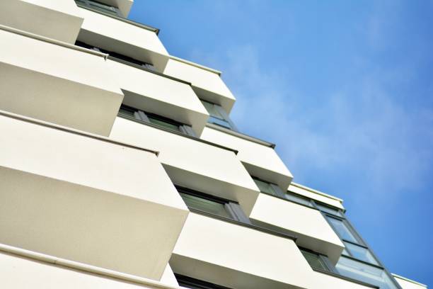 istock Modern white building with balcony on a blue sky 1130800633