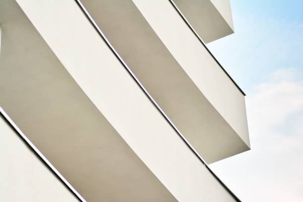istock Modern white building with balcony on a blue sky 1130801784
