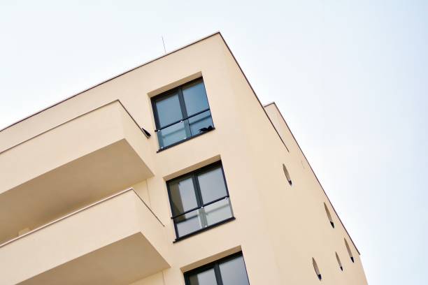 istock Modern white building with balcony on a blue sky 1130801867