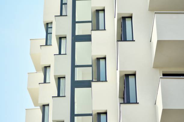 istock Modern white building with balcony on a blue sky 1130801899