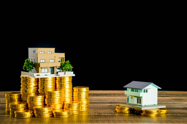 istock Residential model and money 1130802043
