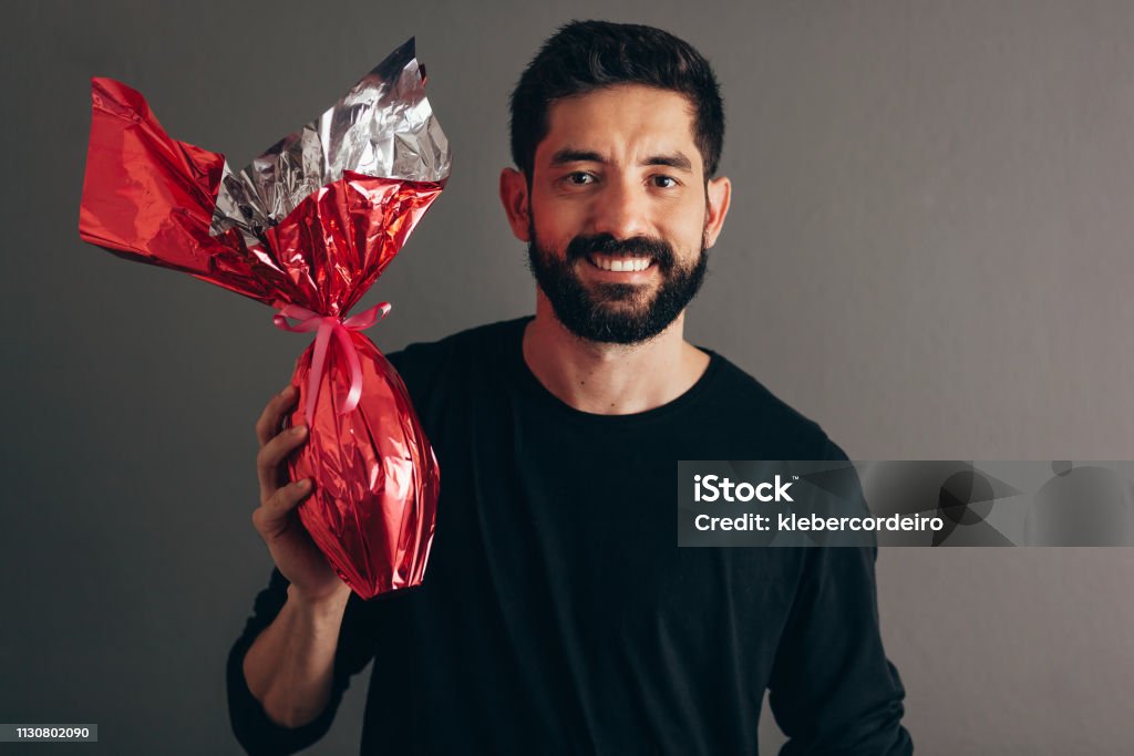 Happy Easter. Happy man holding chocolate easter egg 30-39 Years Stock Photo