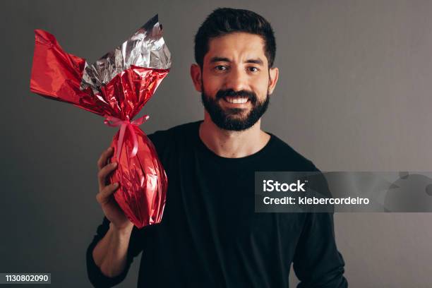 Happy Easter Happy Man Holding Chocolate Easter Egg Stock Photo - Download Image Now