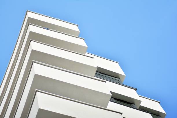 istock Modern white building with balcony on a blue sky 1130802759