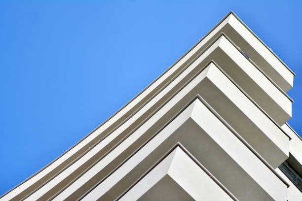 istock Modern white building with balcony on a blue sky 1130802936