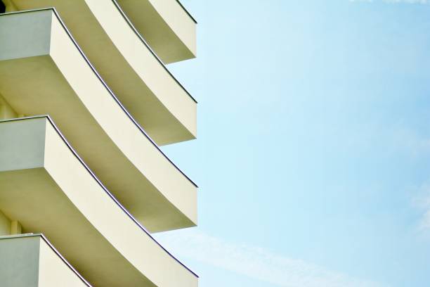 istock Modern white building with balcony on a blue sky 1130802950