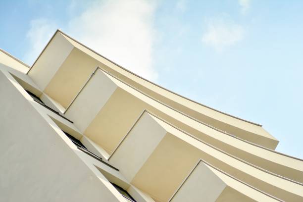 istock Modern white building with balcony on a blue sky 1130803127
