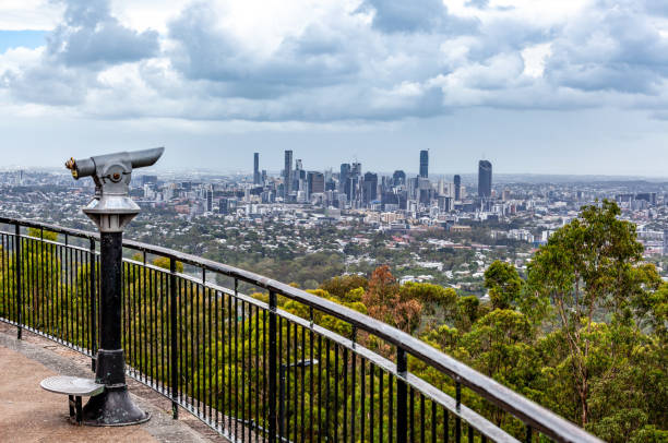 Coin-operated binoculars pointed at Brisbane CBD skyline from lookout stock photo