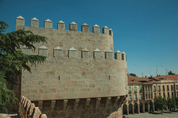 istock Battlement over tower and roofs on buildings at Avila 1130804874