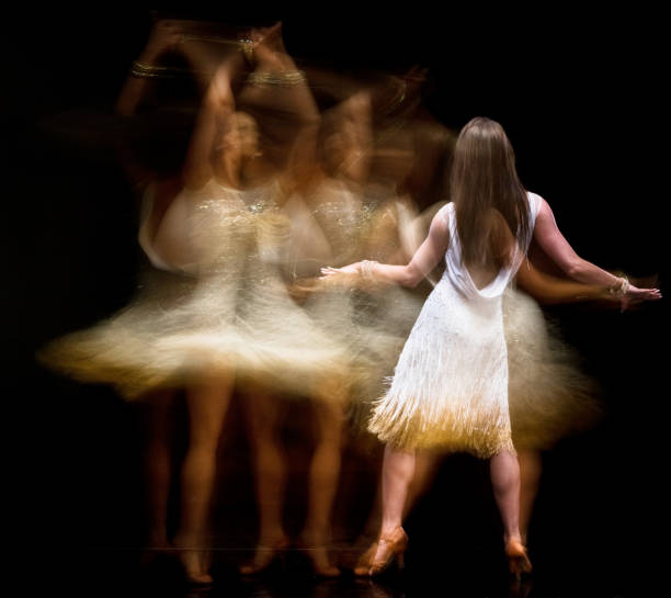 istock Beautiful woman ballroom dancing with motion blur 1130805907