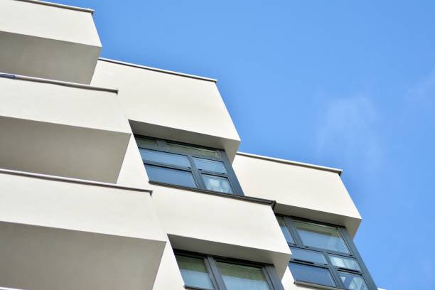 istock Modern white building with balcony on a blue sky 1130806743