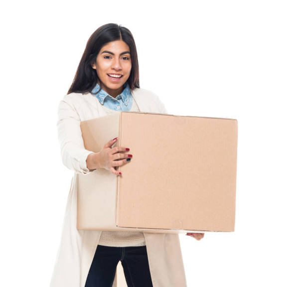 istock Attractive young latino female is holding a box 1130809370