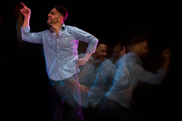 istock Handsome man in a blue shirt dancing 1130817555