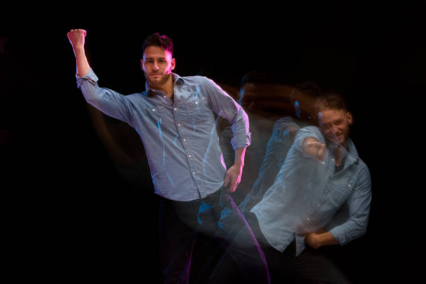 istock Handsome man in a blue shirt dancing 1130817564