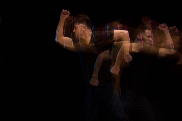 istock Good looking man in a black shirt dancing 1130817582