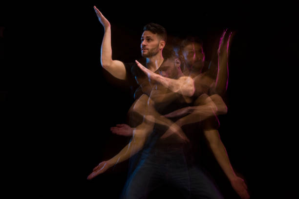 istock Good looking man in a black shirt dancing 1130817583