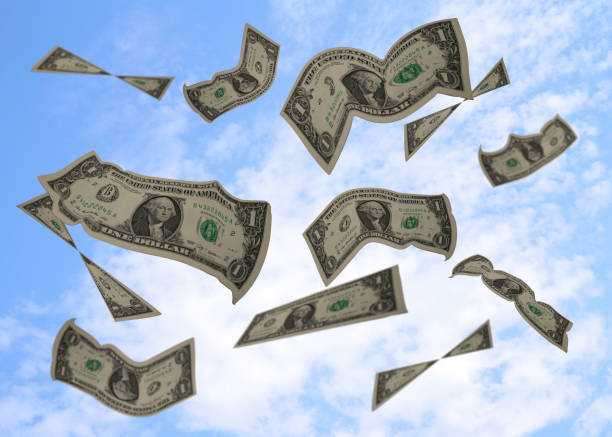 istock Flying US Dollars in the blue sky 1130818482