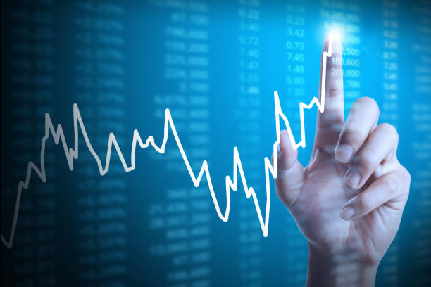 istock businessman with financial chart symbols coming from hand 1130820230