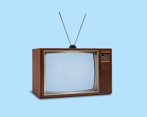 retro 1970's television on blue background - television aerial immagine foto e immagini stock