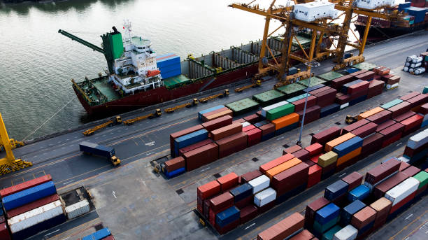 istock Logistics and transportation of Container Cargo ship and Cargo plane with working crane bridge in shipyard, logistic import export and transport industry background 1130824359