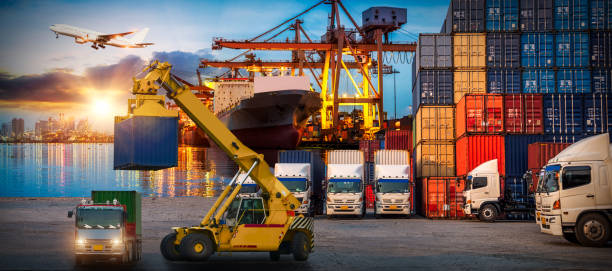 istock Logistics and transportation of Container Cargo ship and Cargo plane with working crane bridge in shipyard at sunrise, logistic import export and transport industry background 1130824412