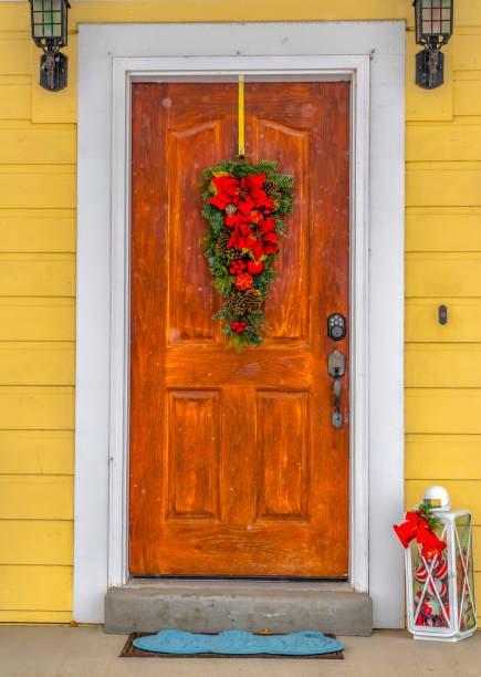 istock Front door with Christmas decoration in winter 1130828343