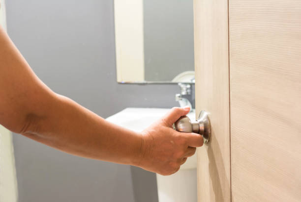 istock Hand man open the door bathroom 1130831076