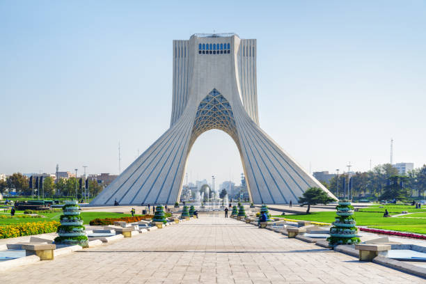 Beautiful view of the Azadi Tower (Freedom Tower), Tehran, Iran Beautiful view of the Azadi Tower (Freedom Tower) on blue sky background in Tehran, Iran. Azadi Square is a popular tourist attraction of the Middle East. tehran stock pictures, royalty-free photos & images