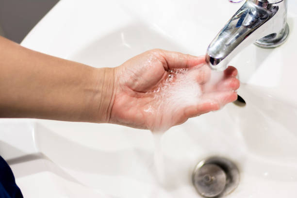 istock Wash hands on sink in a bathroom 1130834174