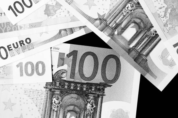 istock One Hundred euro banknotes as a background close up. Black and white 1130835105