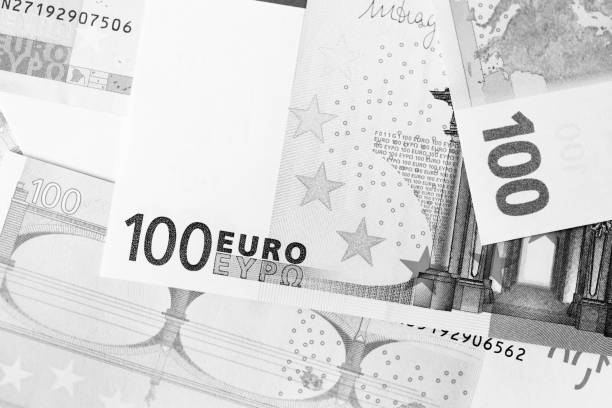 istock One Hundred euro banknotes as a background close up. Black and white 1130835108