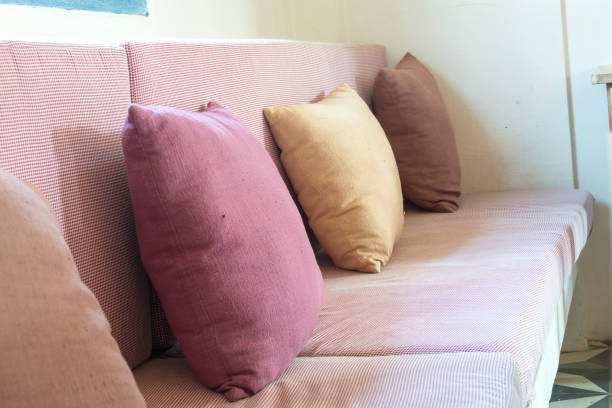 istock Comfortable pillow on sofa bed of pink color 1130836204