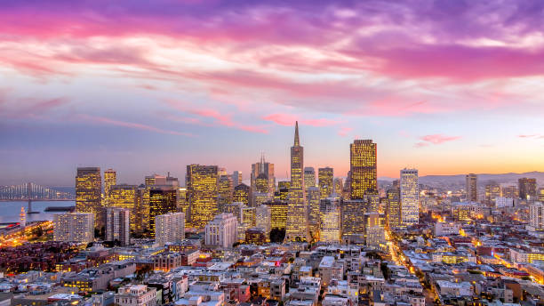 downtown San Francisco at sunset. Beautiful view of  business center in downtown San Francisco at sunset. transamerica pyramid san francisco stock pictures, royalty-free photos & images