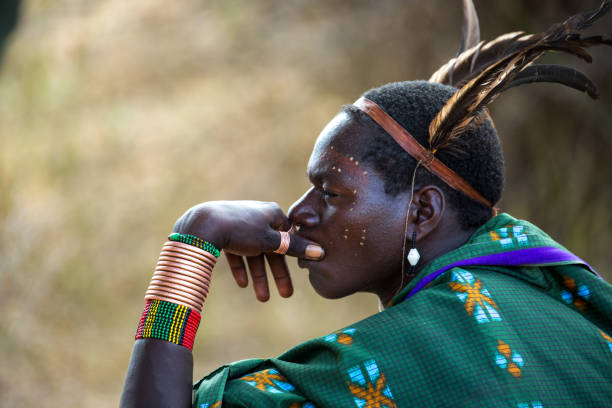 Ethiopia: Hamer Man A man from the Hamer tribe waiting for a bull jumping ceremony to commence in the Omo Valley. hamer tribe photos stock pictures, royalty-free photos & images