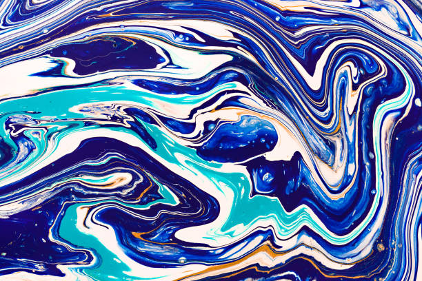 istock Hand painted background with mixed liquid blue, white, yellow paints. Abstract fluid acrylic painting. Applicable for packaging, invitation, textile, wallpaper, design of different surfaces 1130845549
